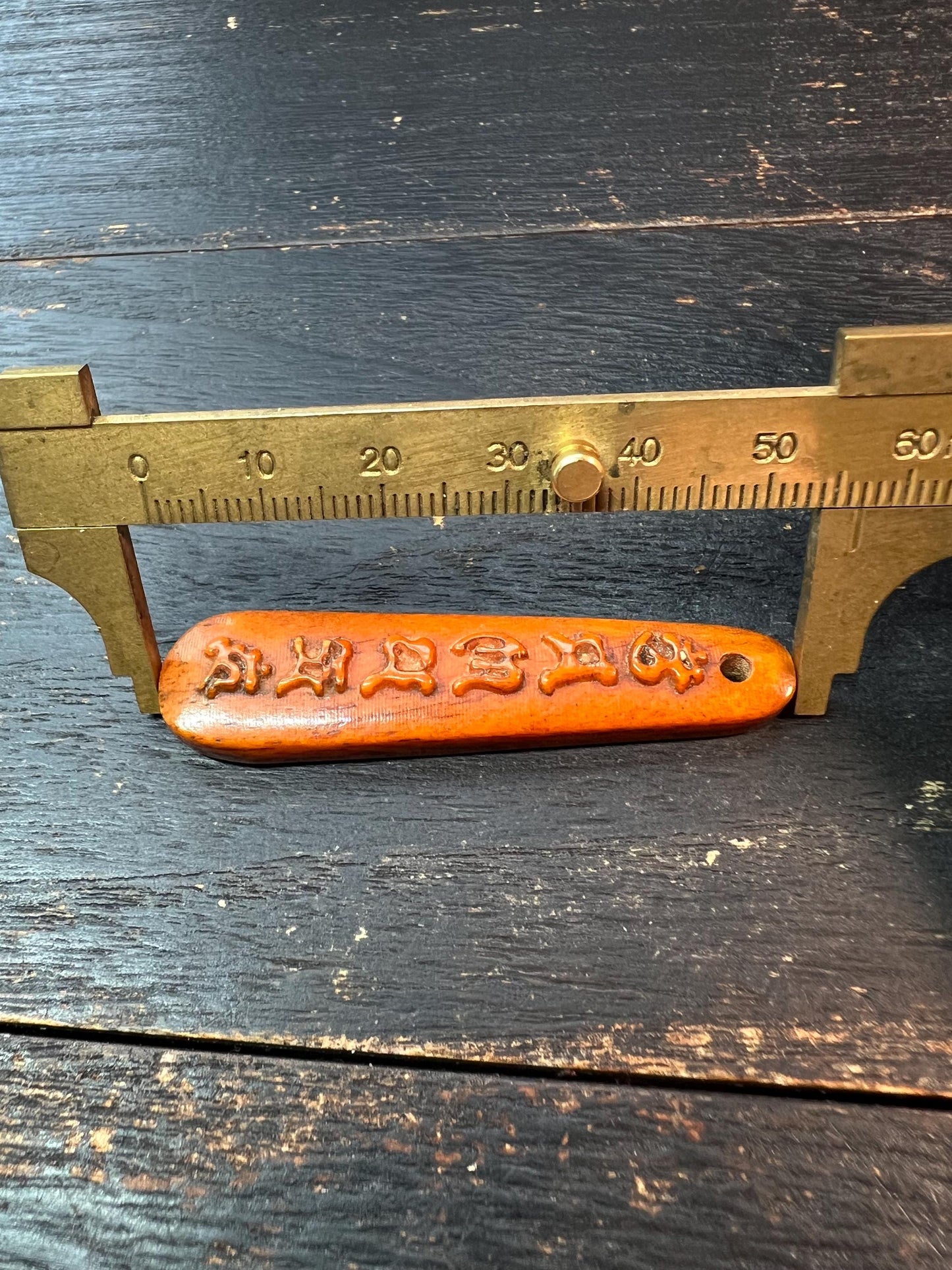 Tibetan Yak Bone Pendant – Hand-Carved Six-Syllable Mantra (“Om Mani Padme Hum”)