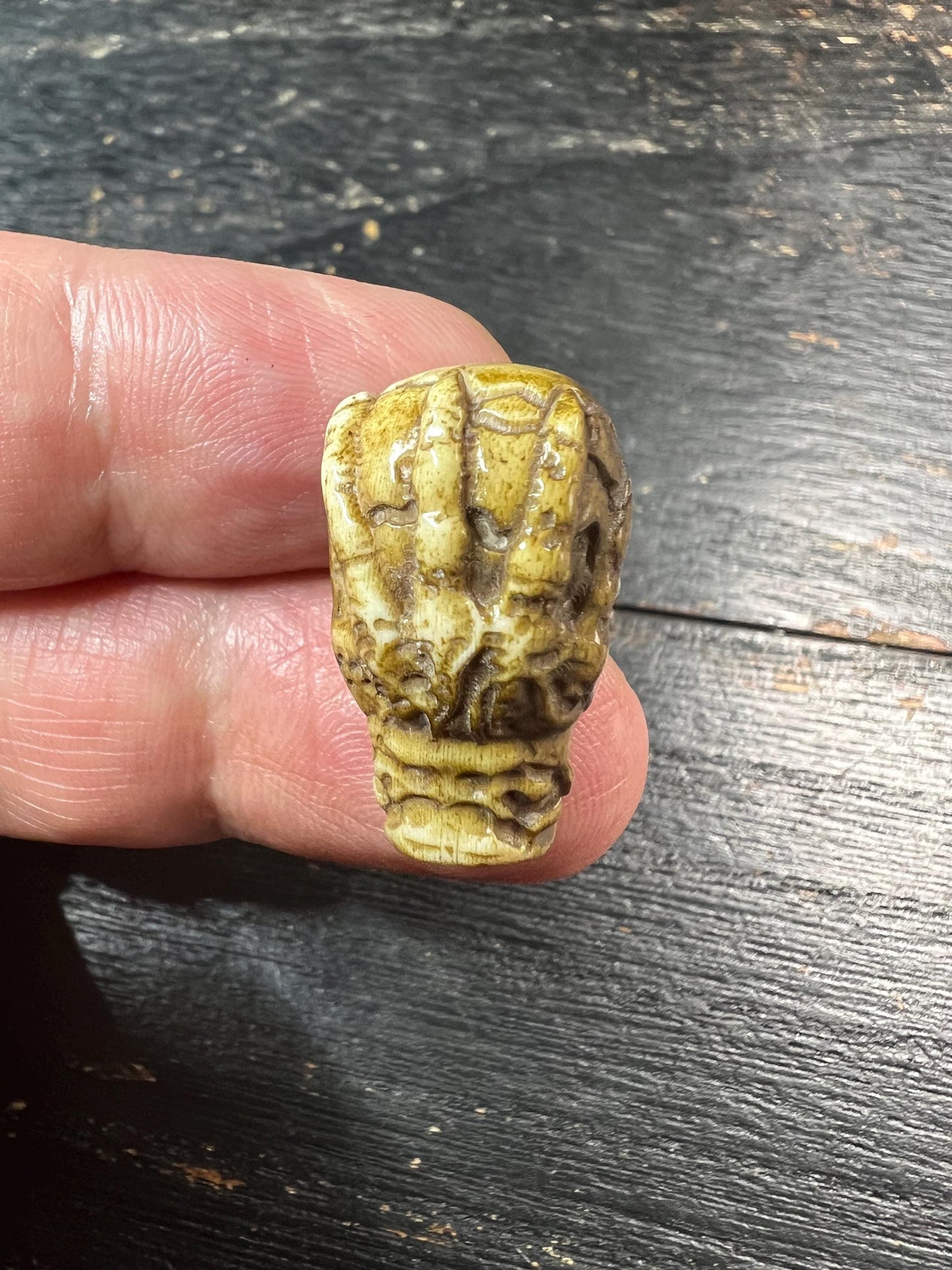 Hand-Carved Deer Antler Citipati Skull Bead with Grasping Bone Hand, Tibetan Charnel Ground Focal Pendant, Vertical Drill