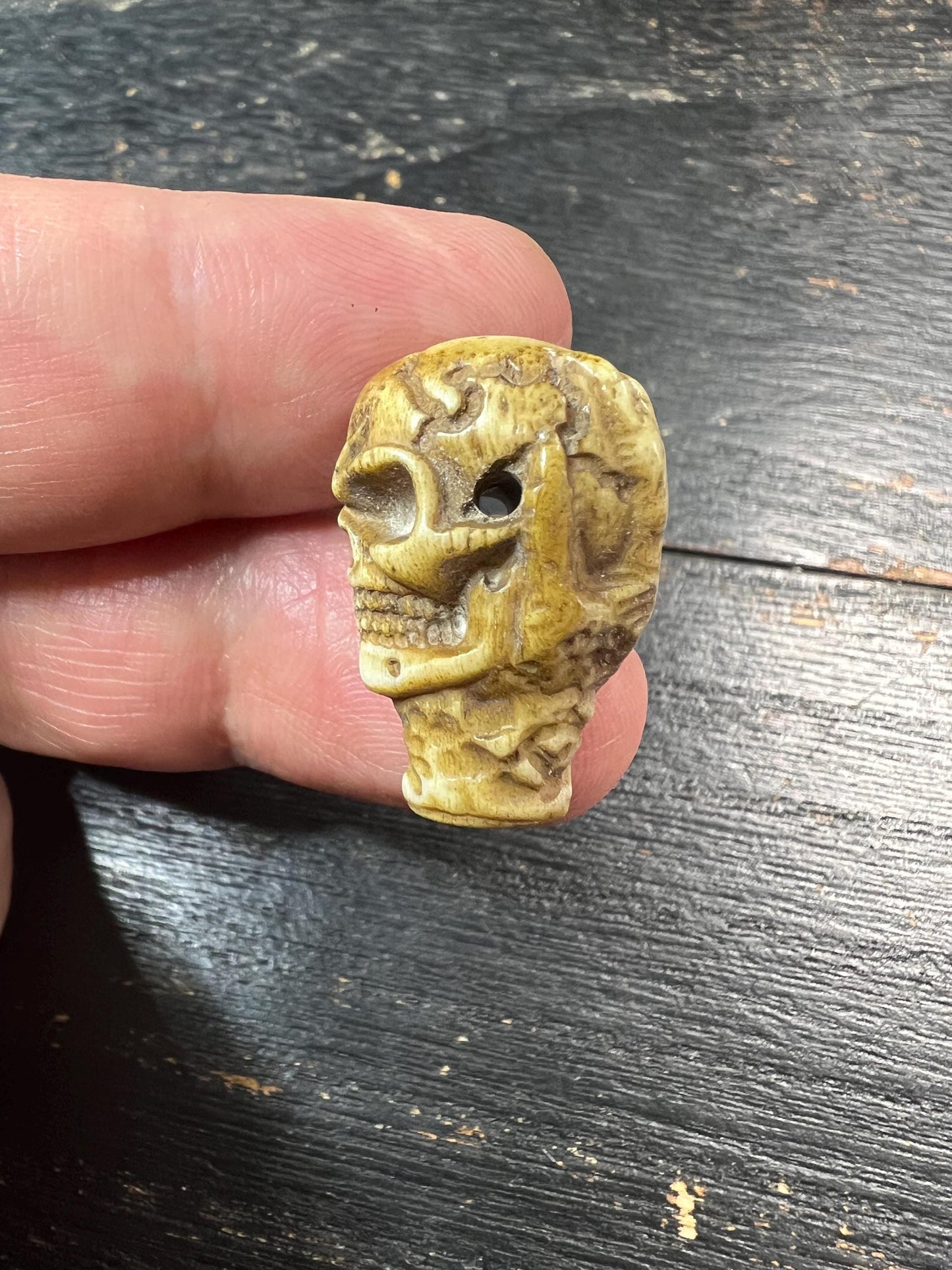 Hand-Carved Deer Antler Citipati Skull Bead with Grasping Bone Hand, Tibetan Charnel Ground Focal Pendant, Vertical Drill