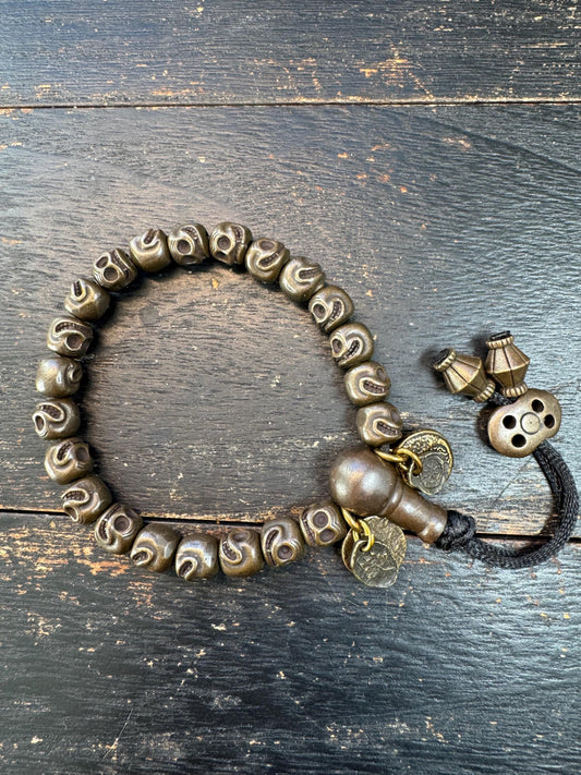 Tibetan Brass Citipati Skull Mala Bracelet | Adjustable 7-8” Wrist Prayer Beads w/ Guru Bead, Lotus Charms, Charnel Ground Amulet