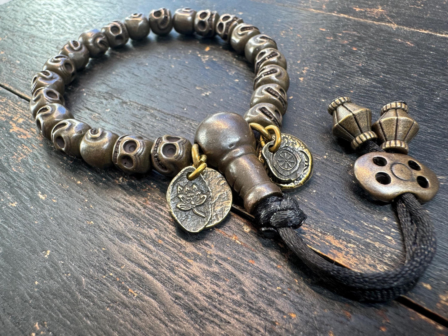 Tibetan Brass Citipati Skull Mala Bracelet | Adjustable 7-8” Wrist Prayer Beads w/ Guru Bead, Lotus Charms, Charnel Ground Amulet