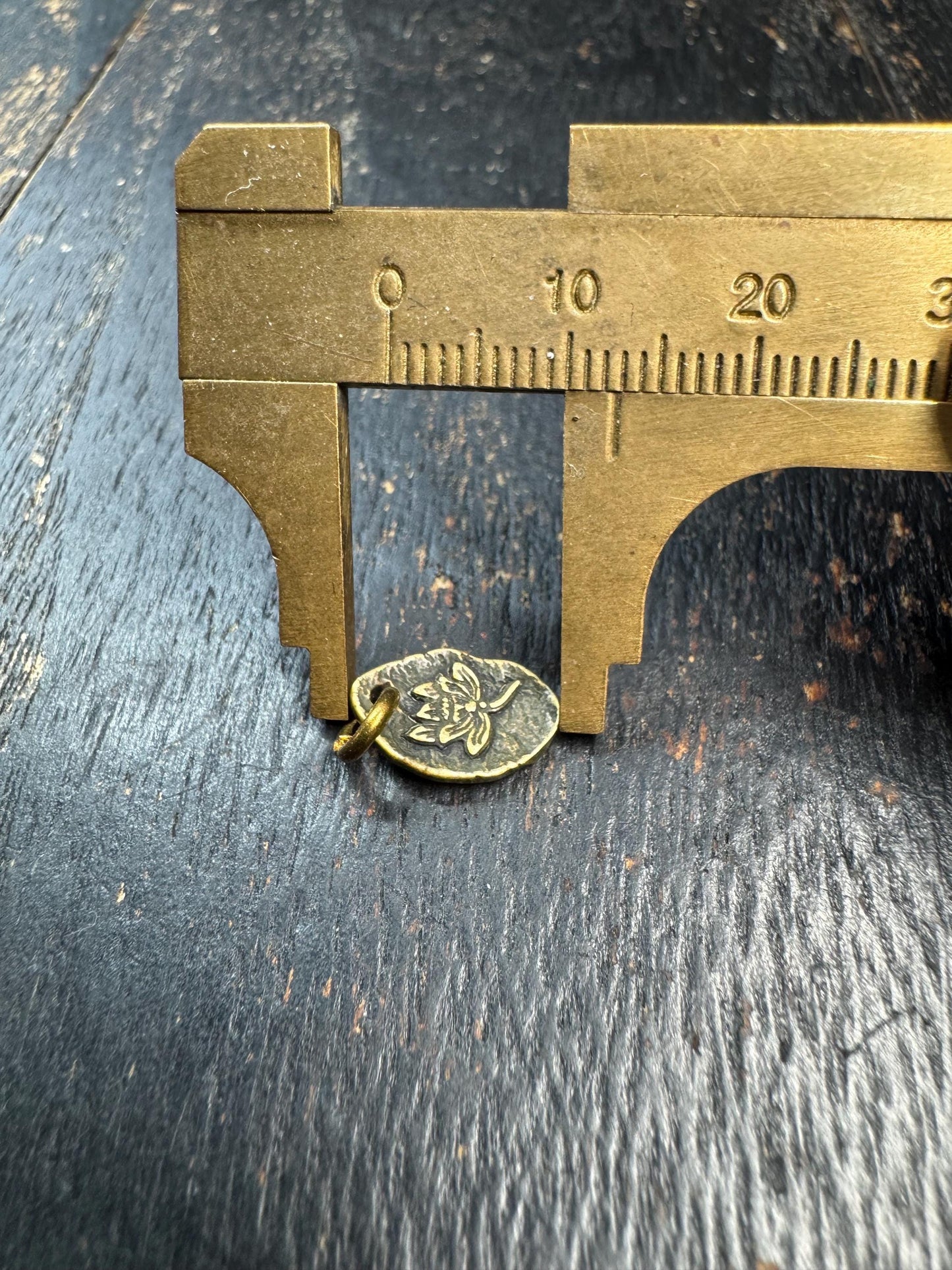 Mini Tibetan Brass Lotus Pendant – Double Sided Charm with Seed Symbol – Antique Style Small Amulet Charm