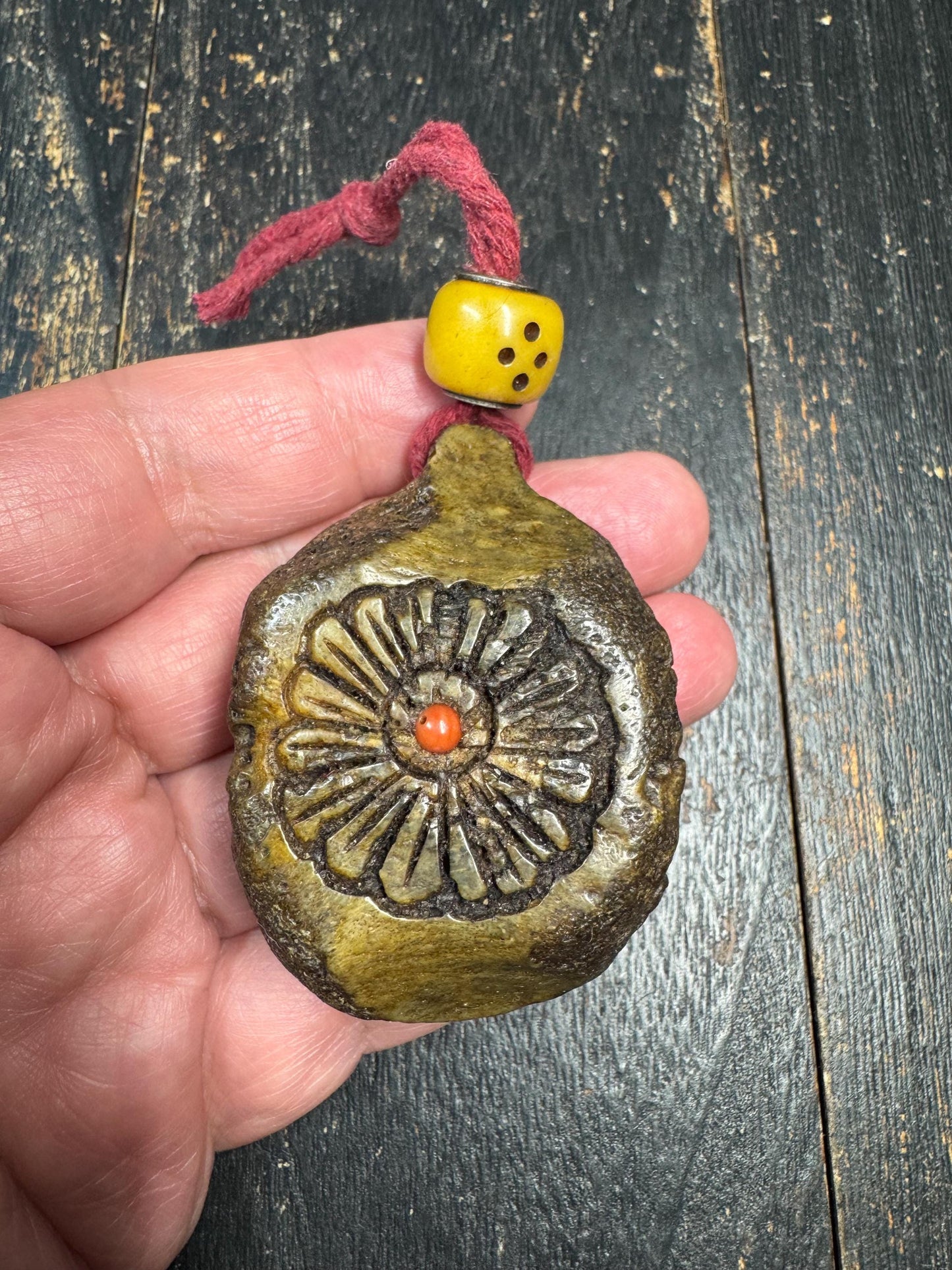 Tibetan Yak Bone Amulet Pendant, Hand Carved Floral Sunburst Design, Tribal Protective Charm, Rustic Spiritual Necklace