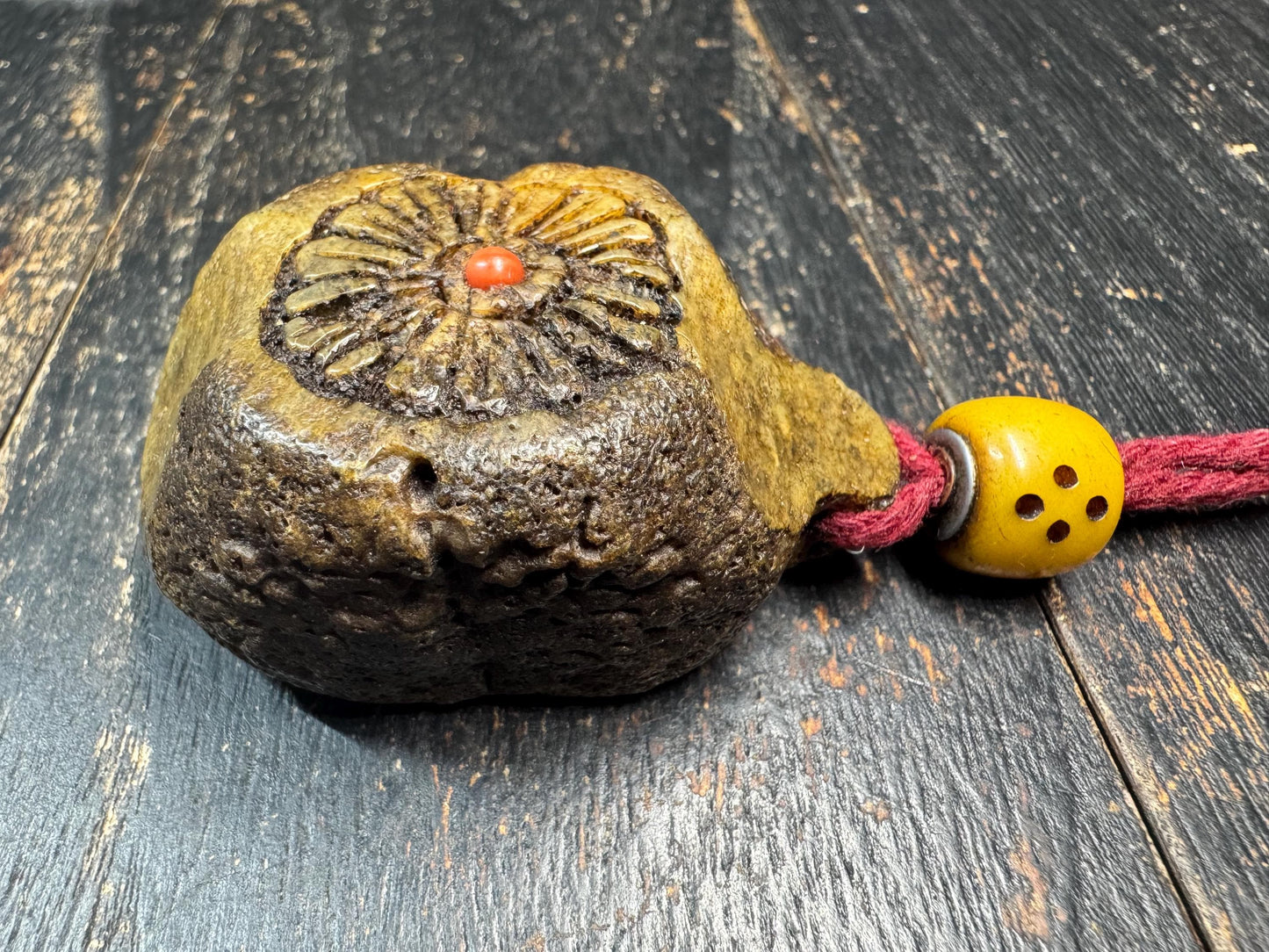 Tibetan Yak Bone Amulet Pendant, Hand Carved Floral Sunburst Design, Tribal Protective Charm, Rustic Spiritual Necklace