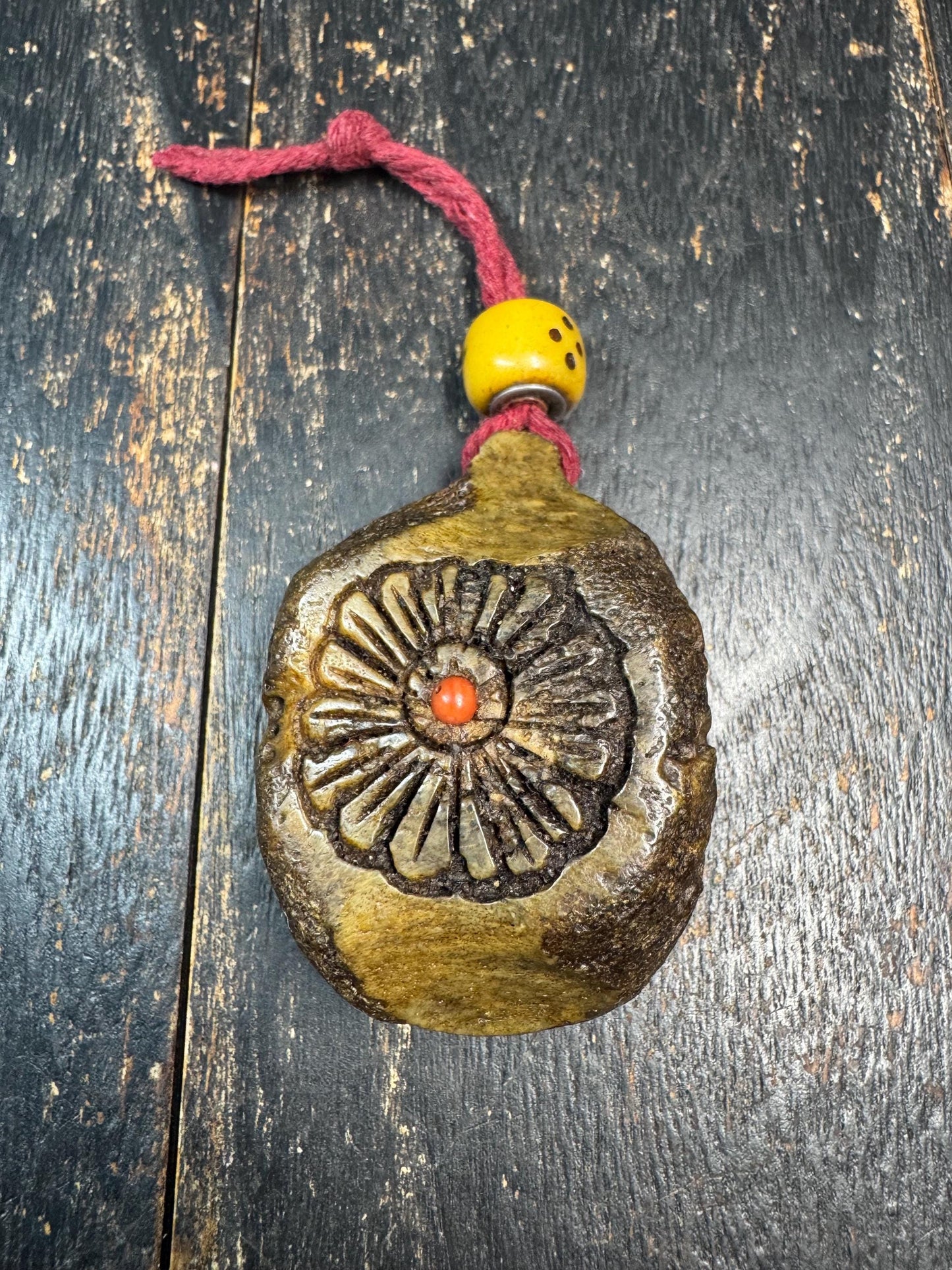 Tibetan Yak Bone Amulet Pendant, Hand Carved Floral Sunburst Design, Tribal Protective Charm, Rustic Spiritual Necklace