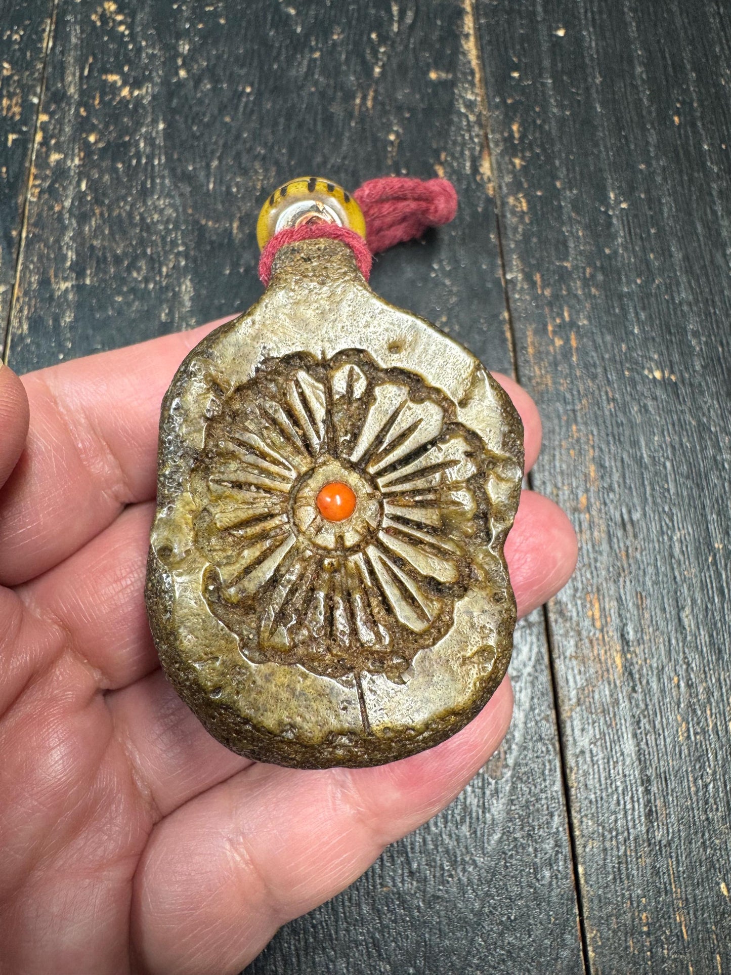 Tibetan Yak Bone Amulet Pendant, Hand Carved Floral Sunburst Design, Tribal Protective Charm, Rustic Spiritual Necklace