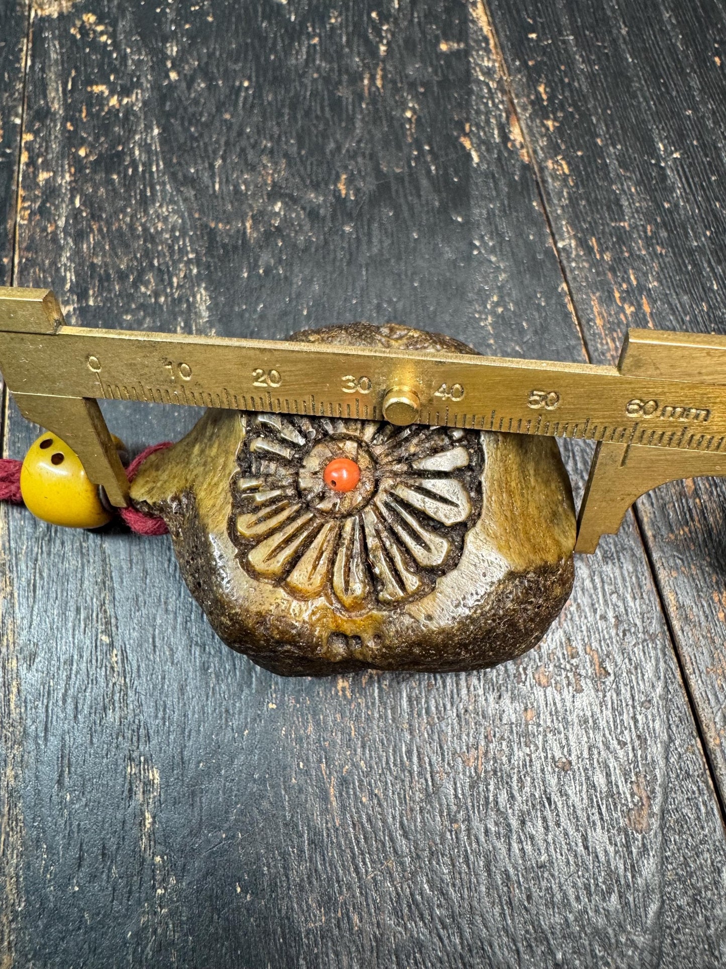 Tibetan Yak Bone Amulet Pendant, Hand Carved Floral Sunburst Design, Tribal Protective Charm, Rustic Spiritual Necklace