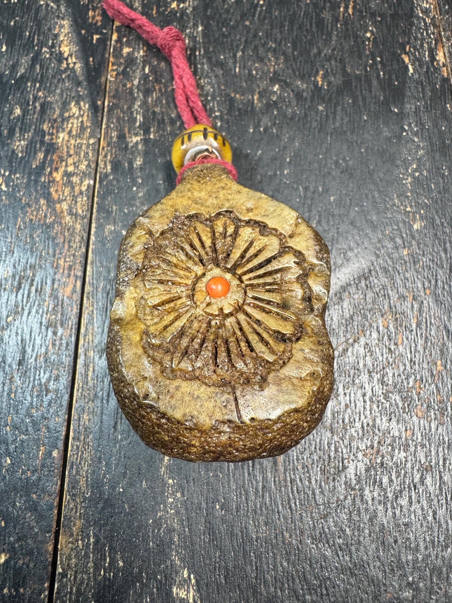 Tibetan Yak Bone Amulet Pendant, Hand Carved Floral Sunburst Design, Tribal Protective Charm, Rustic Spiritual Necklace
